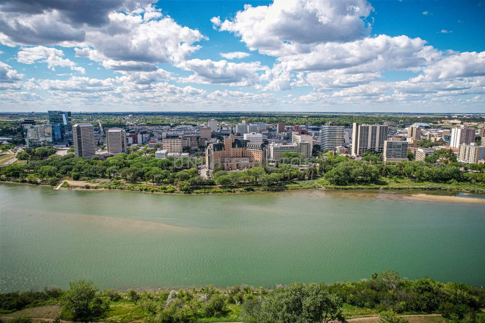 Aerial spectacle of downtown Saskatoon, revealing the city's architectural marvels, bustling streets, and the pulsating core of Saskatchewan's metropolis