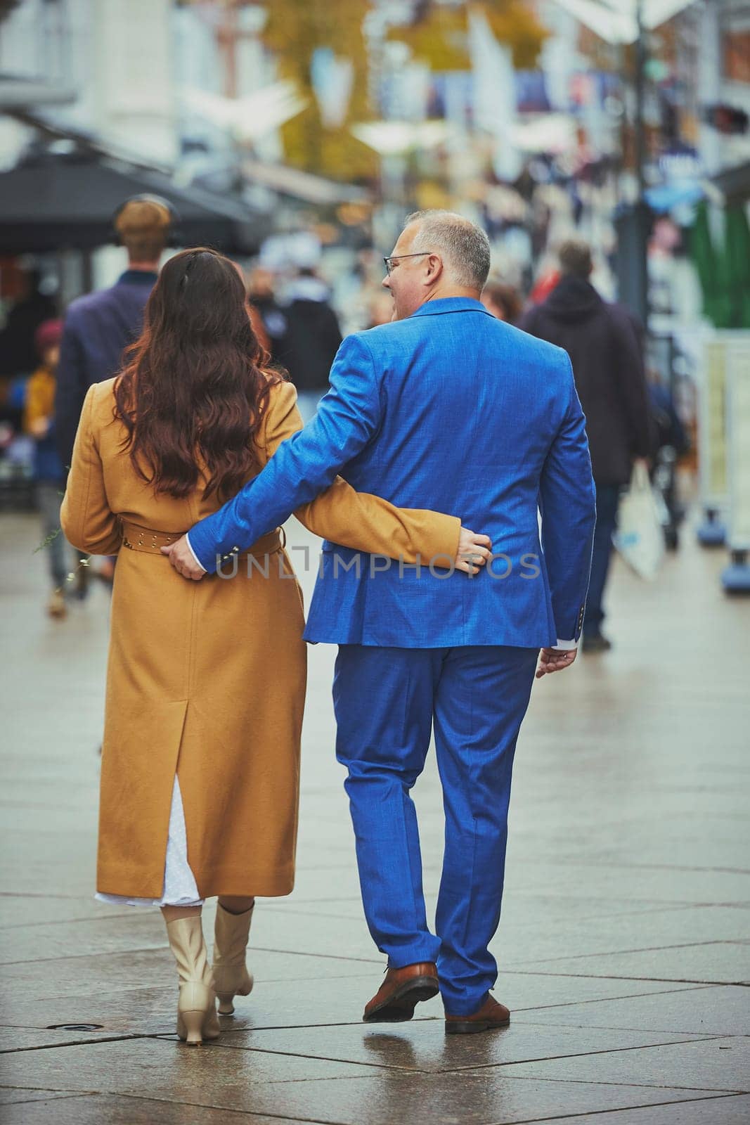 Vejle, Denmark, October 26, 2023: Couple in love walking in the city by Viktor_Osypenko