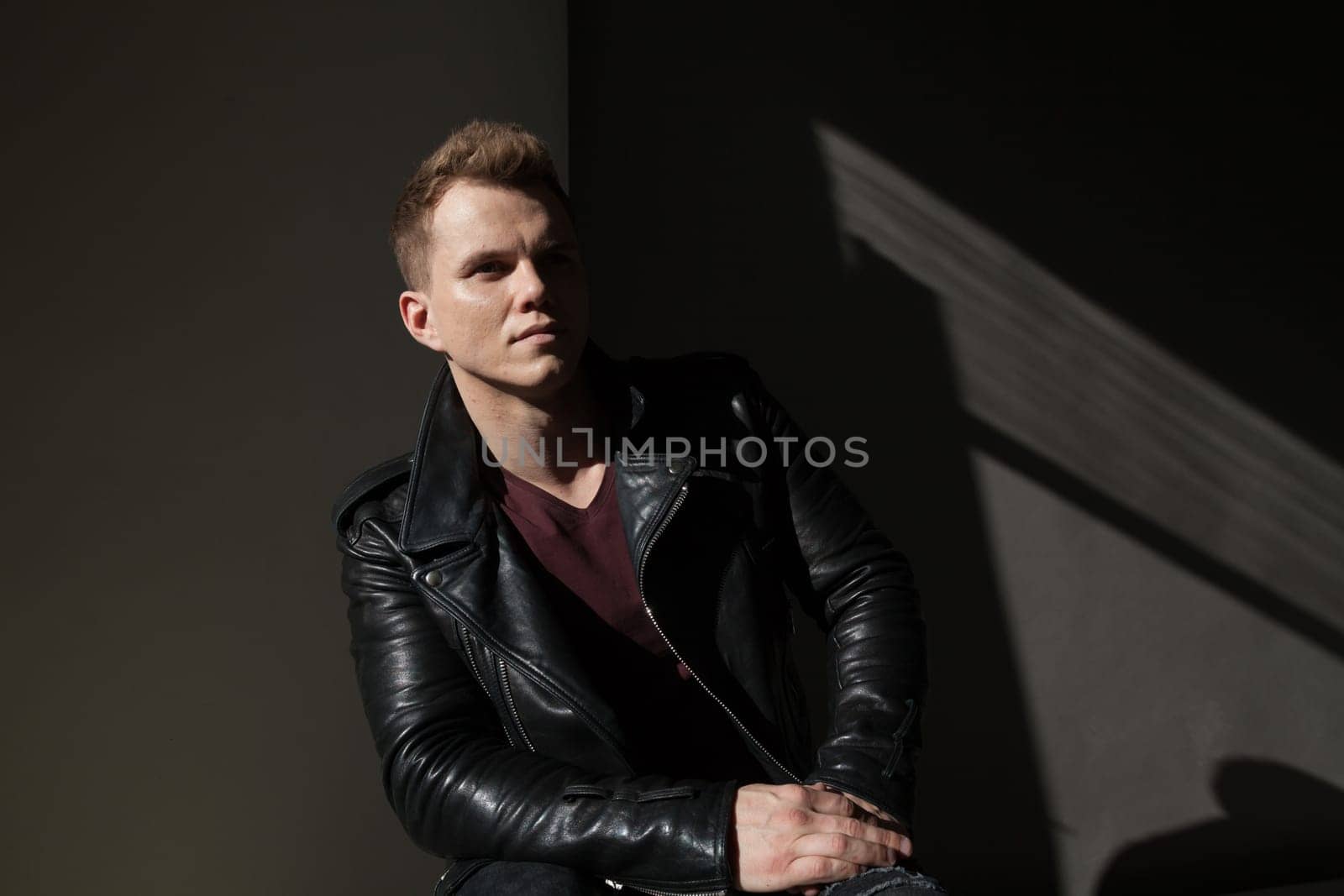 portrait of a fashionable man in a leather jacket by Simakov