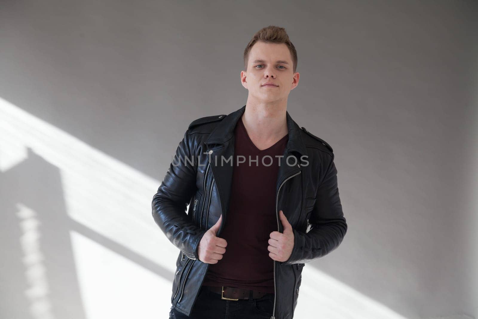 portrait of a fashionable man in a leather jacket by Simakov