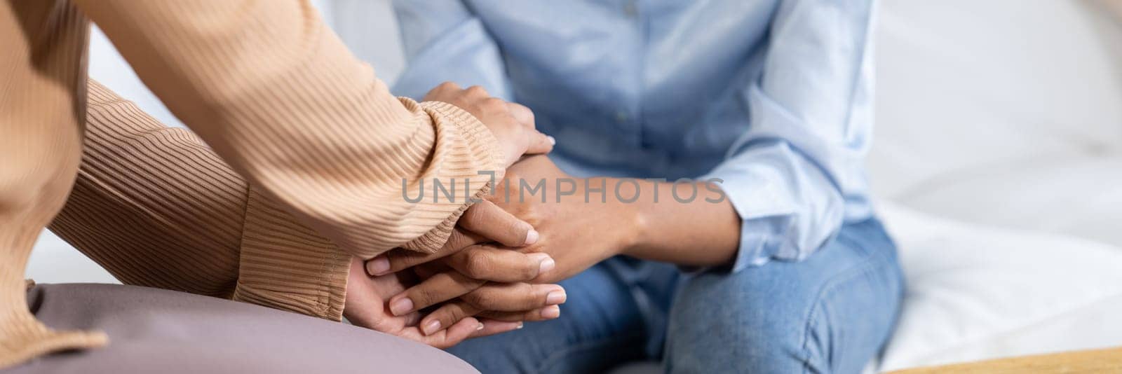 Close up shot of supportive and comforting hands for cheering up depressed patient person or stressed mind with crucial empathy