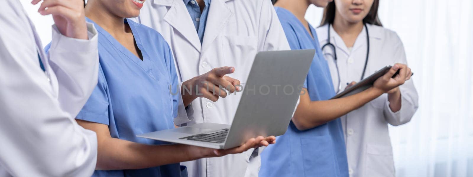 Confident medical staff team working together in panoramic banner. Neoteric by biancoblue