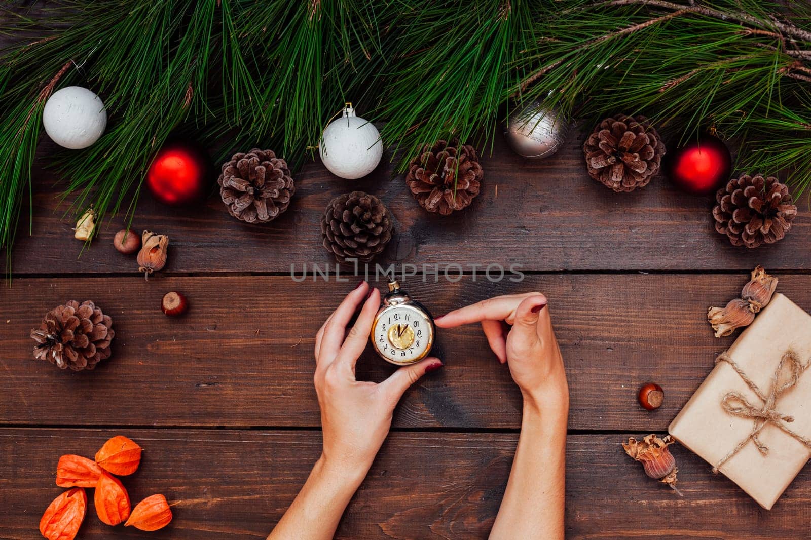 Christmas new year female hands holding Christmas Toys Gifts by Simakov