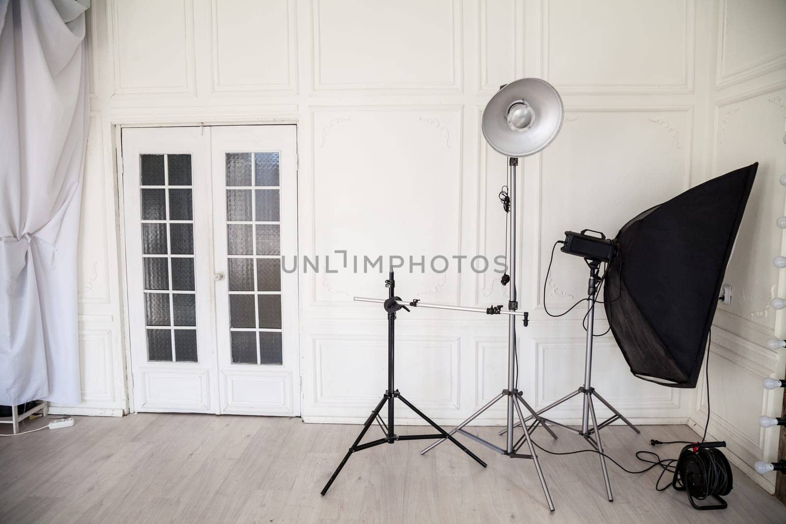 white photo studio interior with flashes and racks by Simakov