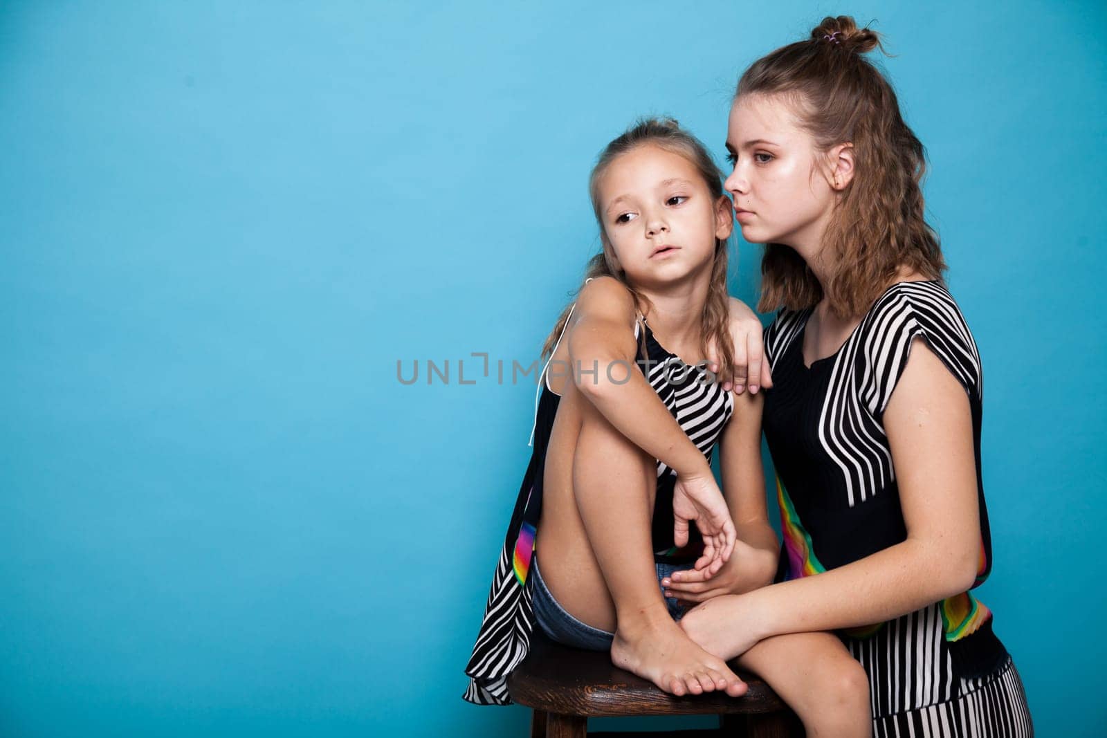 Two fashionable sister girls of different ages