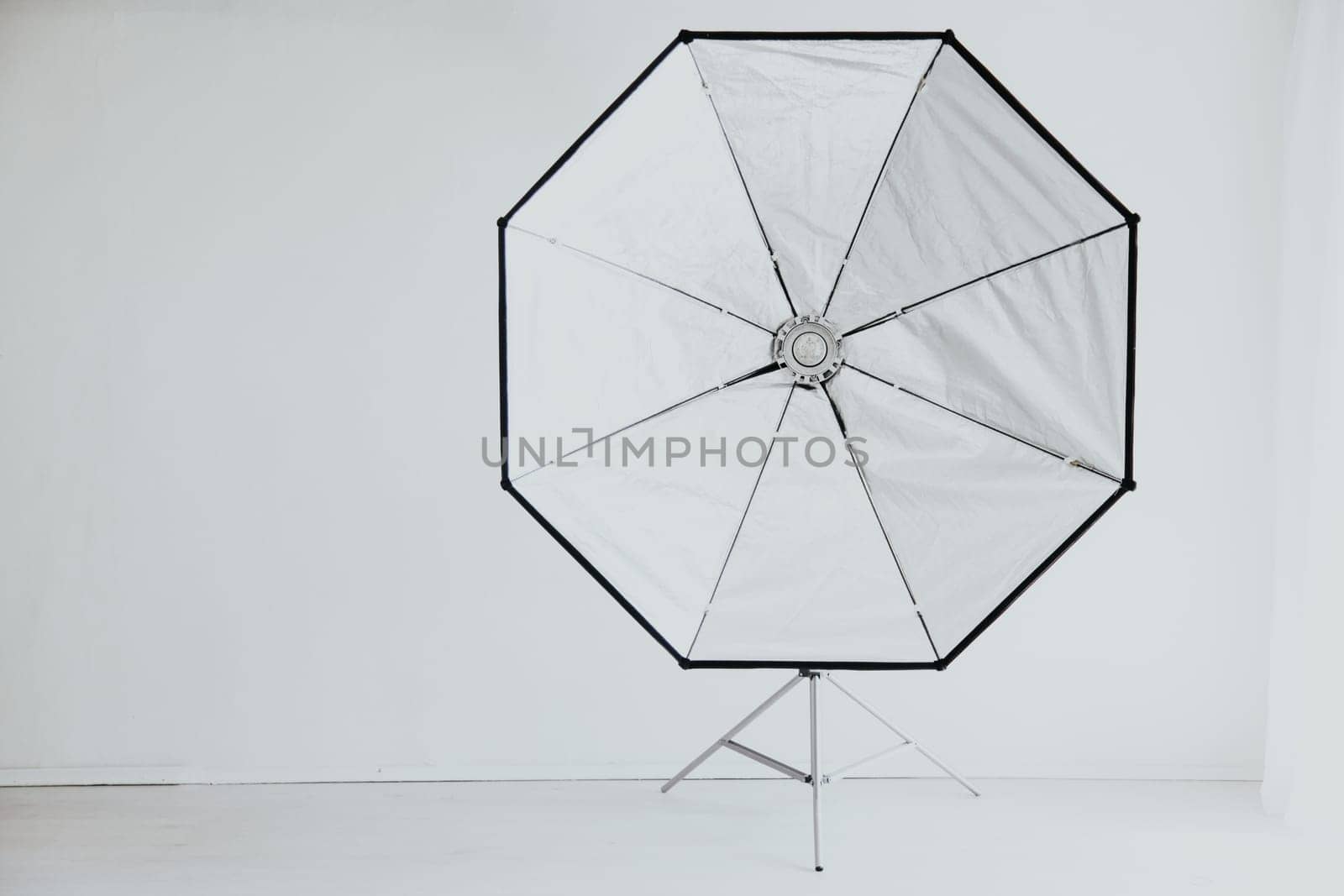 Flash on a white background in the Photo Studio equipment by Simakov