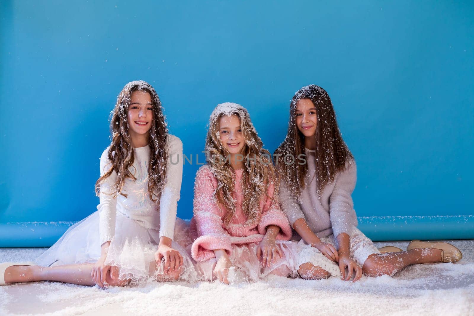 three girls girlfriends play pine snom in winter