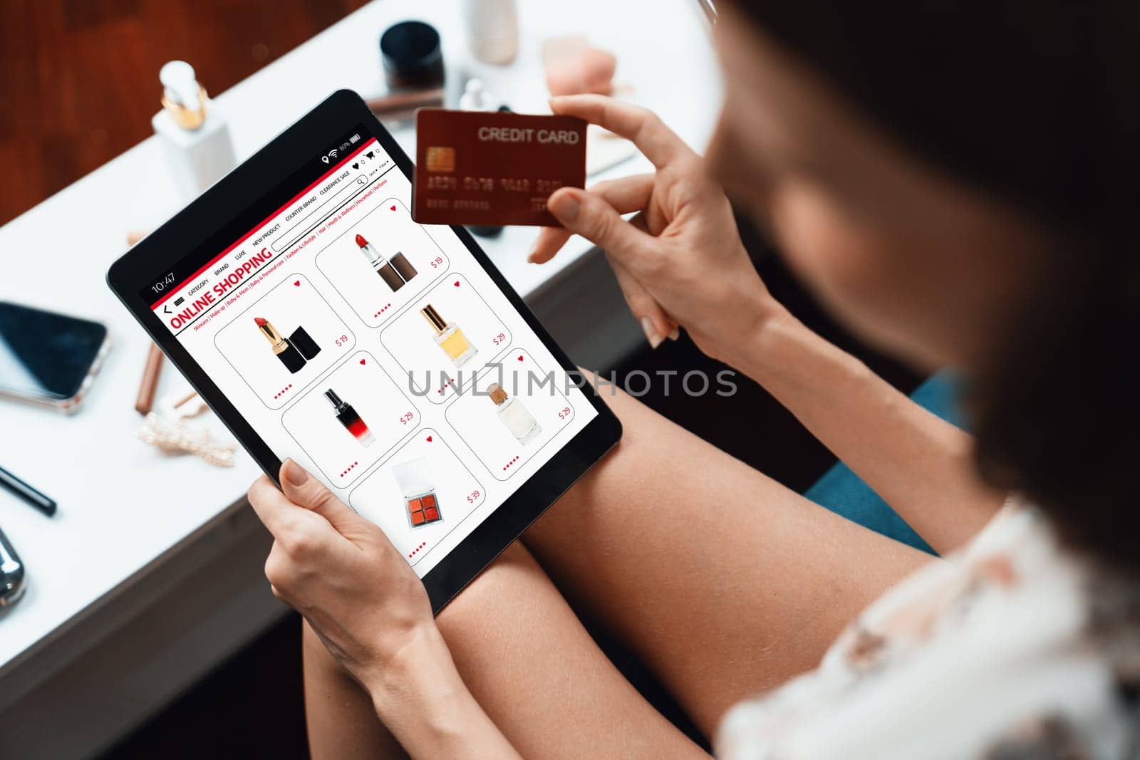 Woman shopping online on internet marketplace browsing for sale items for modern lifestyle and use credit card for online payment from wallet protected by utmost cyber security software