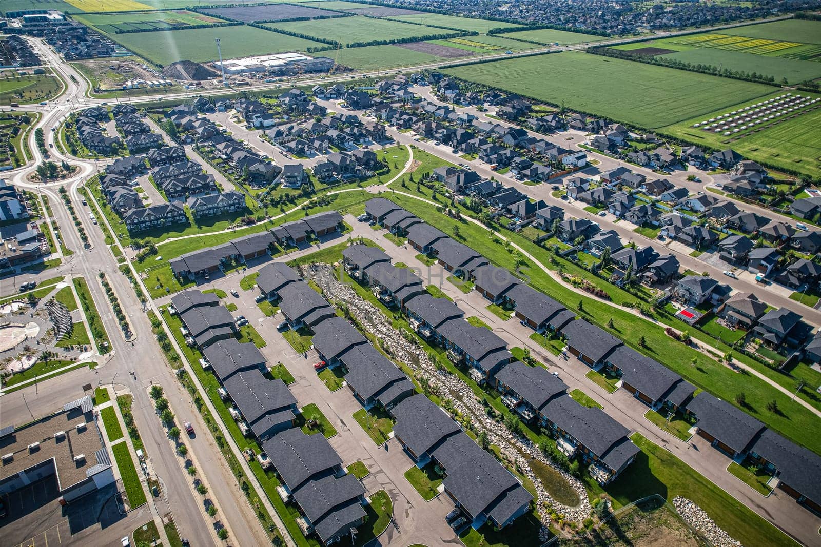 Stunning bird's-eye perspective of the Evergreen neighborhood in Saskatoon, showcasing the unique urban layout and the natural beauty of Saskatchewan's landscapes.