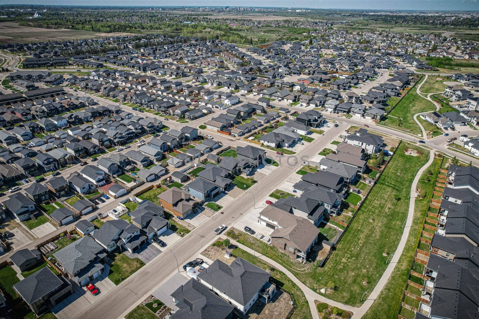 Stunning bird's-eye perspective of the Evergreen neighborhood in Saskatoon, showcasing the unique urban layout and the natural beauty of Saskatchewan's landscapes.