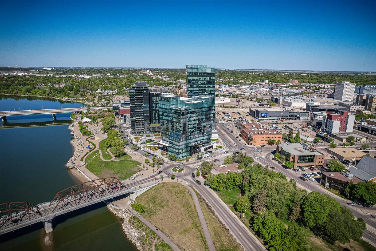 Aerial spectacle of downtown Saskatoon, revealing the city's architectural marvels, bustling streets, and the pulsating core of Saskatchewan's metropolis