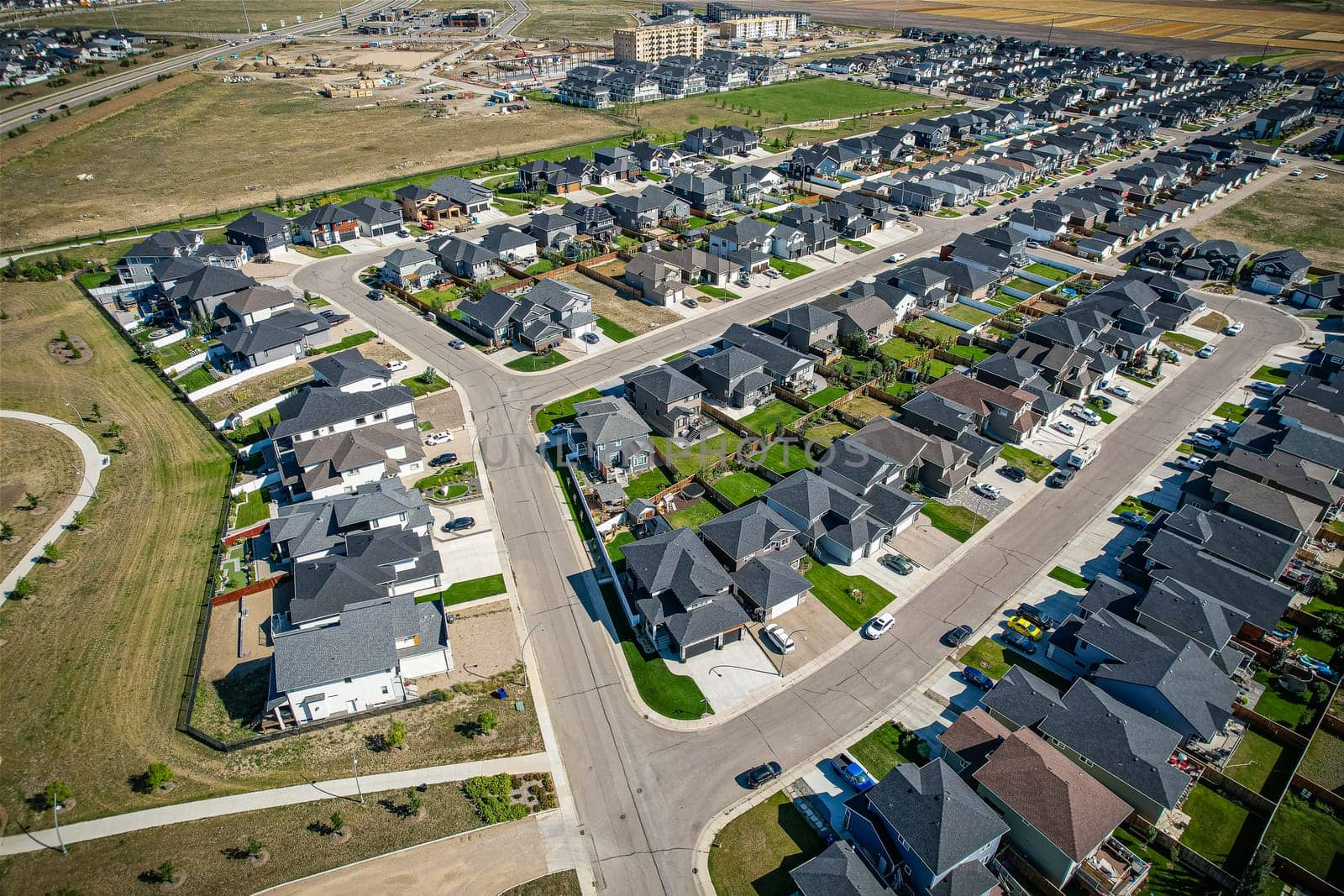 Stunning bird's-eye perspective of the Evergreen neighborhood in Saskatoon, showcasing the unique urban layout and the natural beauty of Saskatchewan's landscapes.
