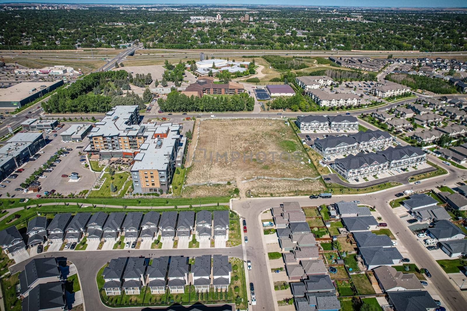 Captivating aerial shot of Stonebridge in Saskatoon, highlighting the harmonious blend of modern architecture and Saskatchewan's verdant surroundings.