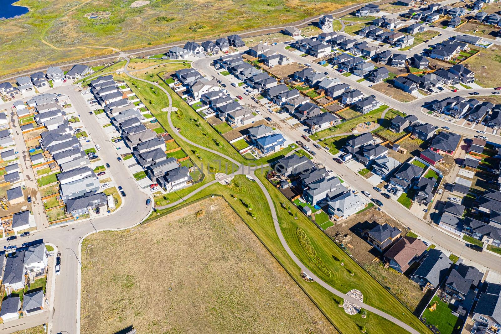 Discover the stunning Aspen Ridge in Saskatoon through this captivating aerial view. Captured by drone, this image showcases the unique urban landscape, serene parks, and vibrant community life. Experience the beauty of Saskatchewan from a breathtaking new perspective.