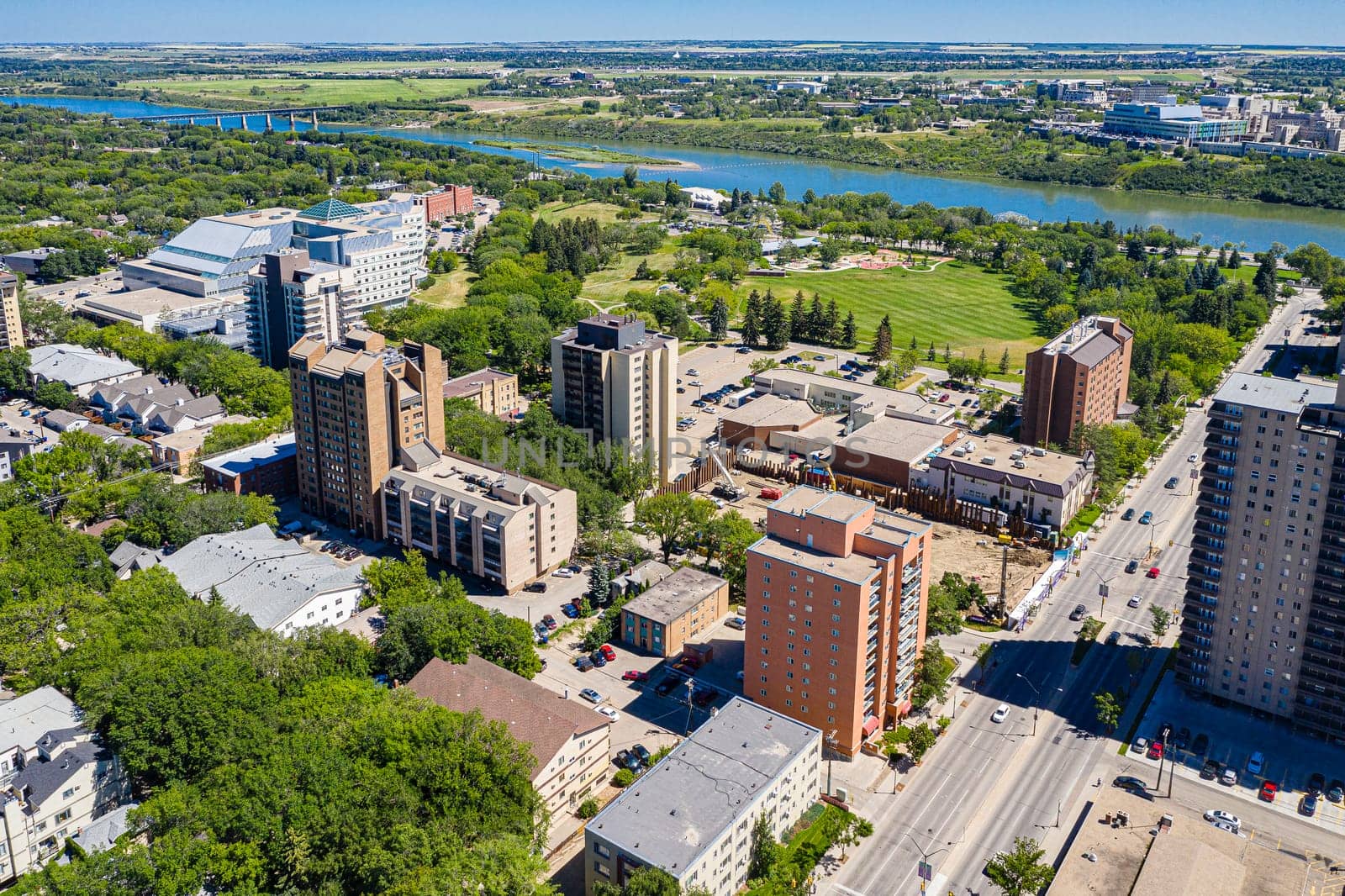 Discover the vibrant City Park neighborhood in Saskatoon from above. This drone image captures its lush green spaces, historic charm, and lively urban atmosphere, offering a unique aerial perspective.