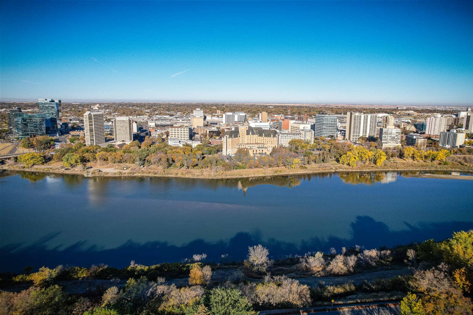 Aerial spectacle of downtown Saskatoon, revealing the city's architectural marvels, bustling streets, and the pulsating core of Saskatchewan's metropolis