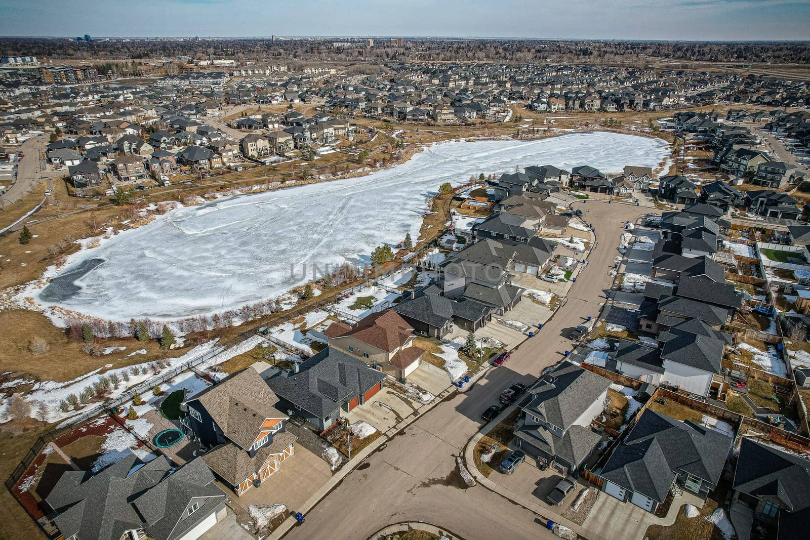 Captivating aerial shot of Stonebridge in Saskatoon, highlighting the harmonious blend of modern architecture and Saskatchewan's verdant surroundings.
