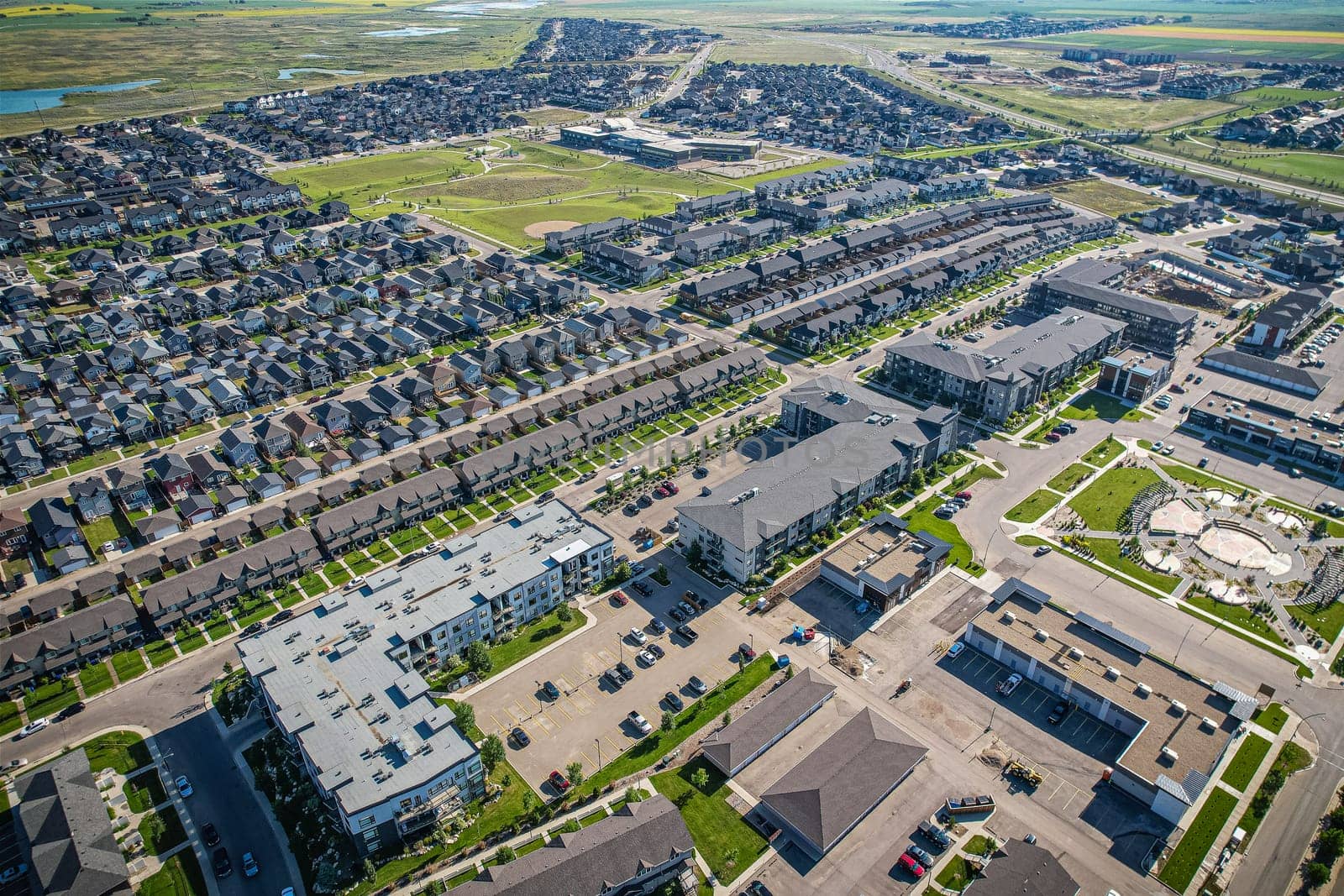 Stunning bird's-eye perspective of the Evergreen neighborhood in Saskatoon, showcasing the unique urban layout and the natural beauty of Saskatchewan's landscapes.