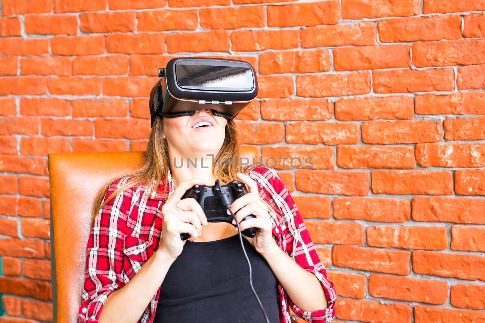 Woman play video game with joystick and VR device by Satura86