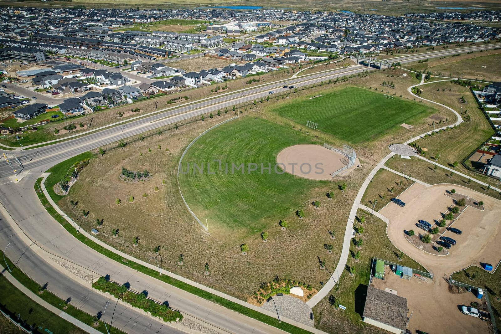 Stunning bird's-eye perspective of the Evergreen neighborhood in Saskatoon, showcasing the unique urban layout and the natural beauty of Saskatchewan's landscapes.