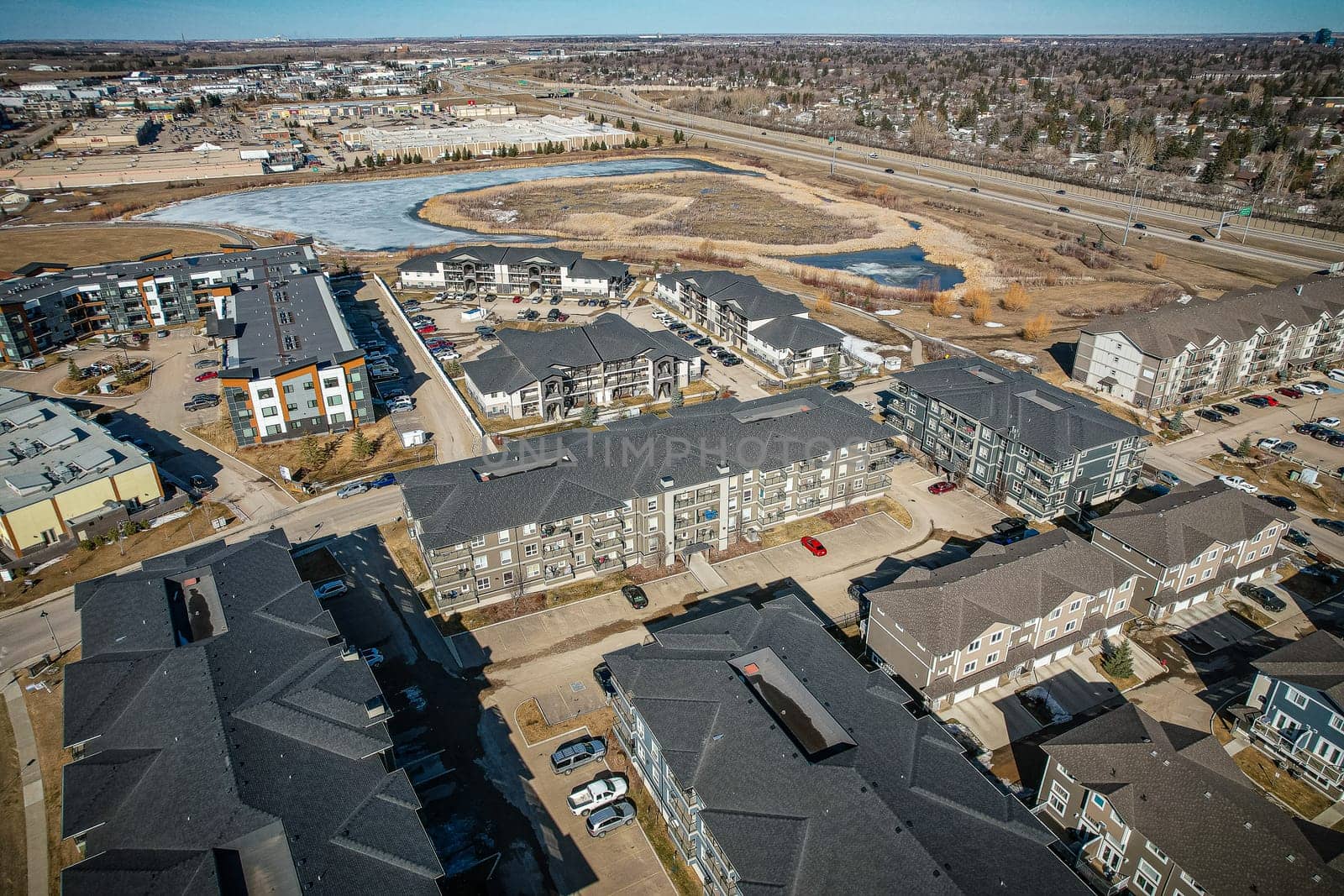 Captivating aerial shot of Stonebridge in Saskatoon, highlighting the harmonious blend of modern architecture and Saskatchewan's verdant surroundings.