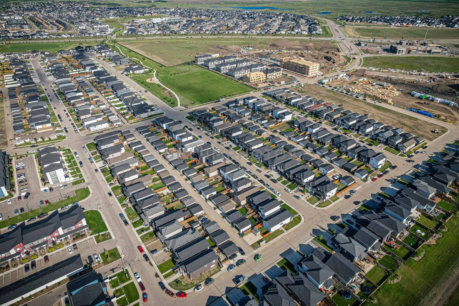 Stunning bird's-eye perspective of the Evergreen neighborhood in Saskatoon, showcasing the unique urban layout and the natural beauty of Saskatchewan's landscapes.