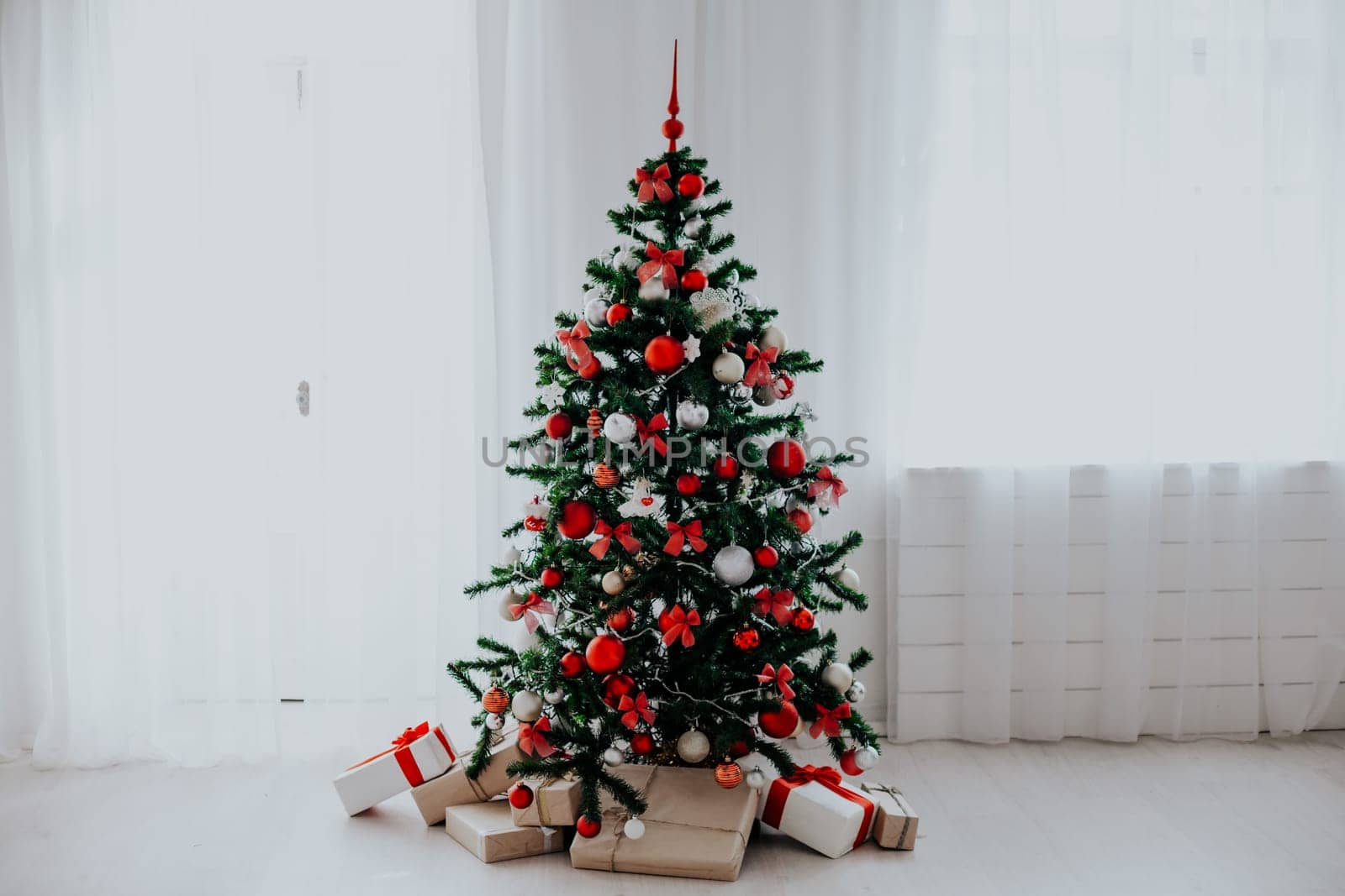 Christmas tree with red decorations new year gifts 2018