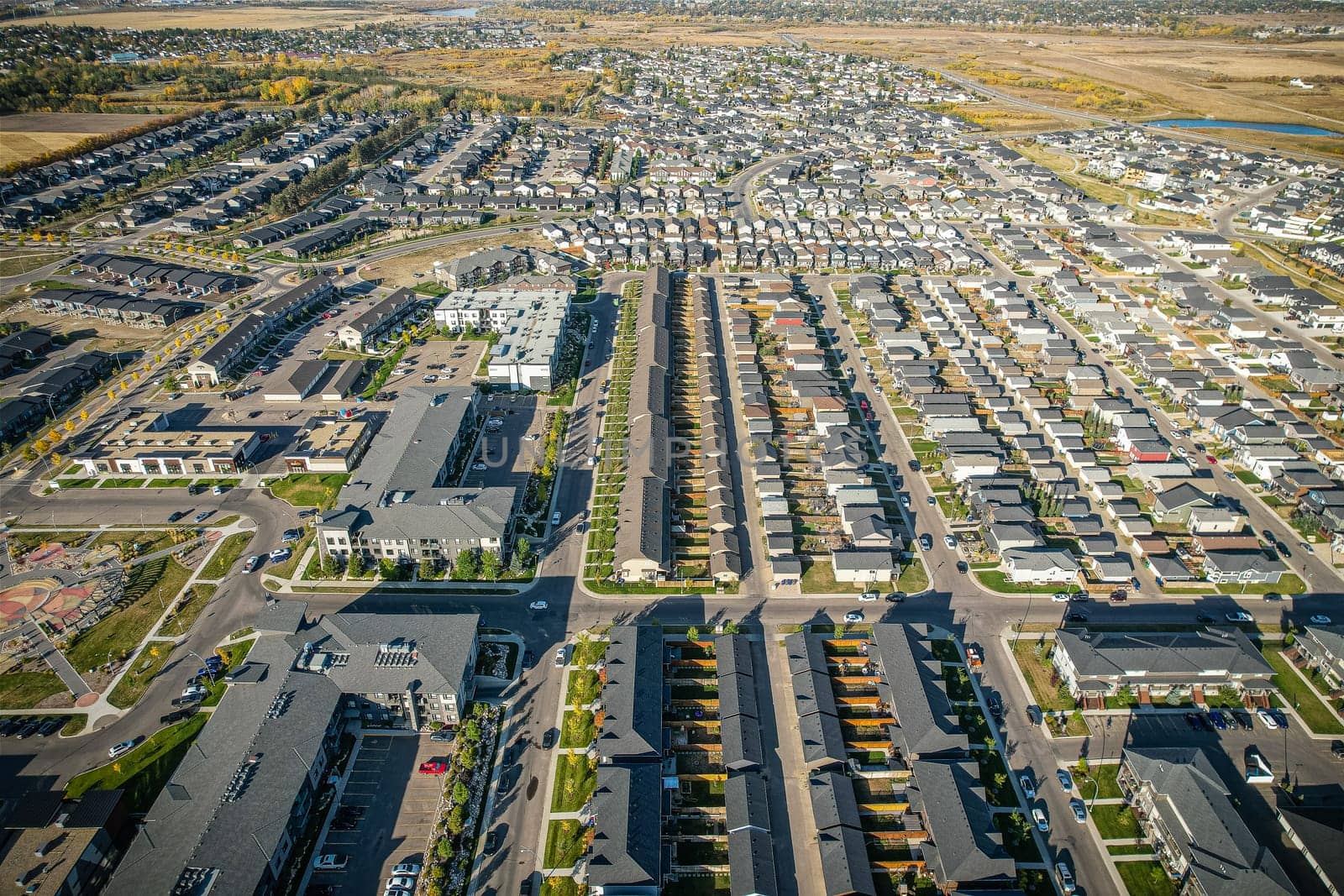 Stunning bird's-eye perspective of the Evergreen neighborhood in Saskatoon, showcasing the unique urban layout and the natural beauty of Saskatchewan's landscapes.