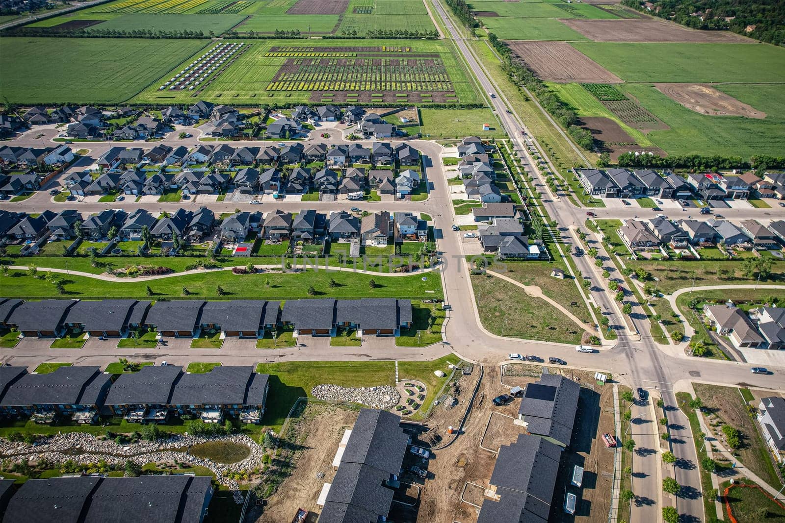 Stunning bird's-eye perspective of the Evergreen neighborhood in Saskatoon, showcasing the unique urban layout and the natural beauty of Saskatchewan's landscapes.