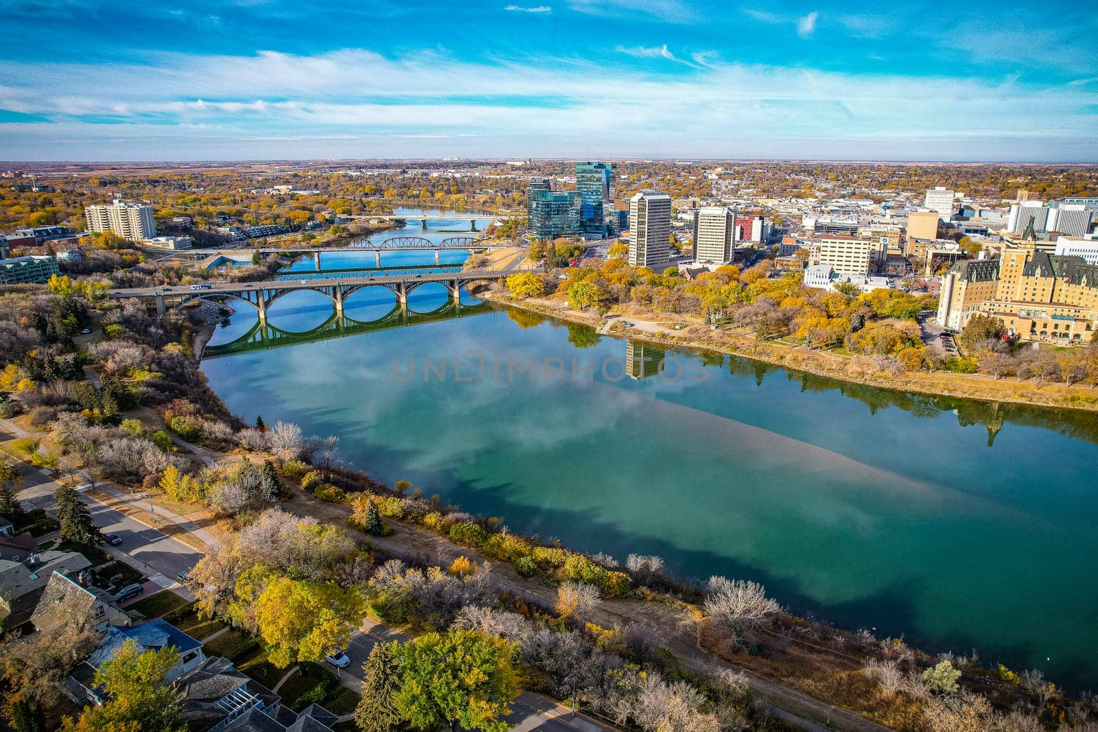Aerial spectacle of downtown Saskatoon, revealing the city's architectural marvels, bustling streets, and the pulsating core of Saskatchewan's metropolis