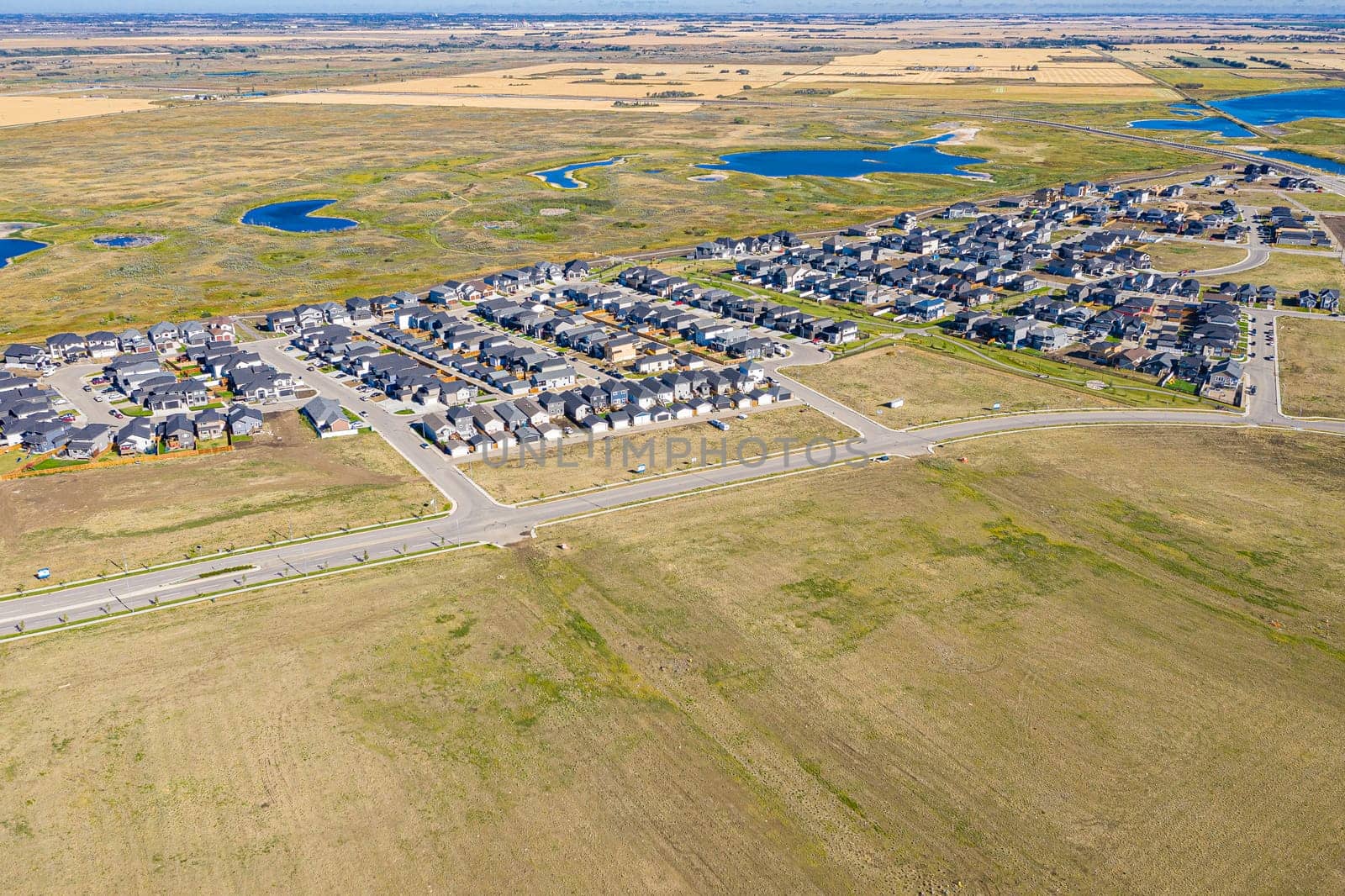 Discover the stunning Aspen Ridge in Saskatoon through this captivating aerial view. Captured by drone, this image showcases the unique urban landscape, serene parks, and vibrant community life. Experience the beauty of Saskatchewan from a breathtaking new perspective.