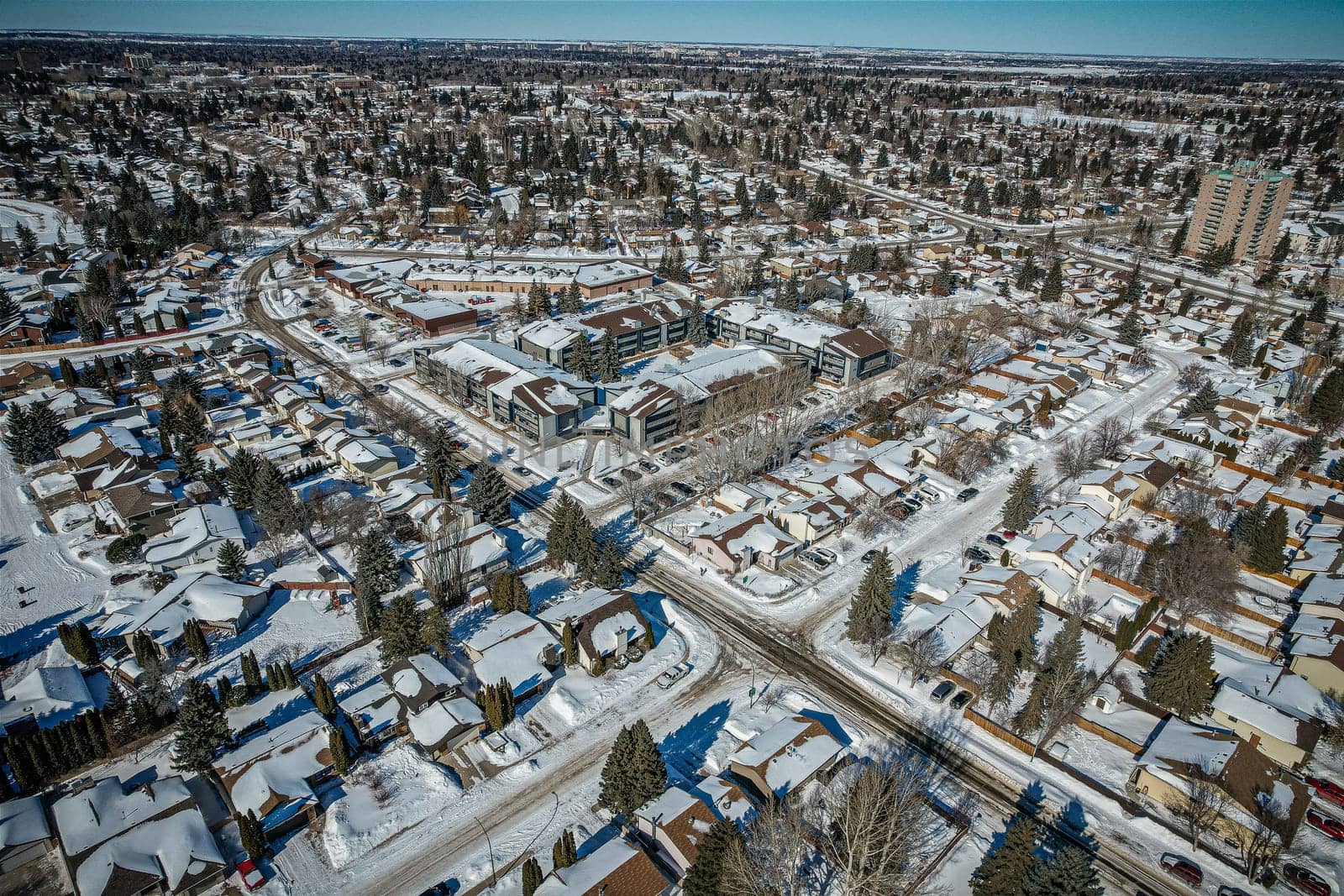 Soaring over Lakeview in Saskatoon, this bird's-eye capture magnifies the neighborhood's tranquil waters, verdant parks, and the serene rhythm of Saskatchewan living