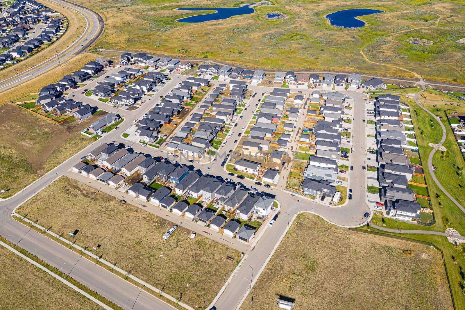 Discover the stunning Aspen Ridge in Saskatoon through this captivating aerial view. Captured by drone, this image showcases the unique urban landscape, serene parks, and vibrant community life. Experience the beauty of Saskatchewan from a breathtaking new perspective.