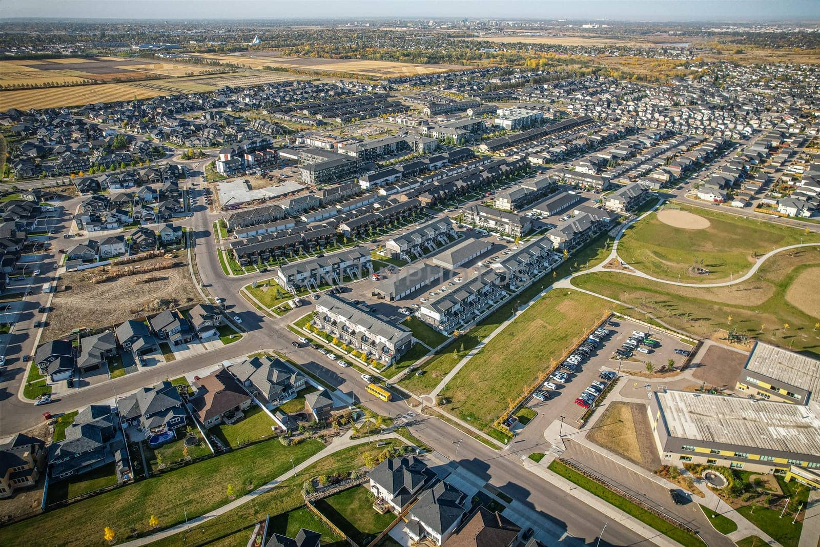Stunning bird's-eye perspective of the Evergreen neighborhood in Saskatoon, showcasing the unique urban layout and the natural beauty of Saskatchewan's landscapes.