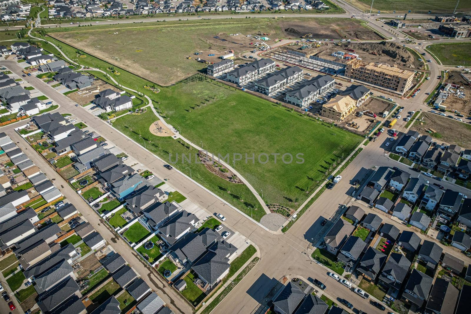 Stunning bird's-eye perspective of the Evergreen neighborhood in Saskatoon, showcasing the unique urban layout and the natural beauty of Saskatchewan's landscapes.