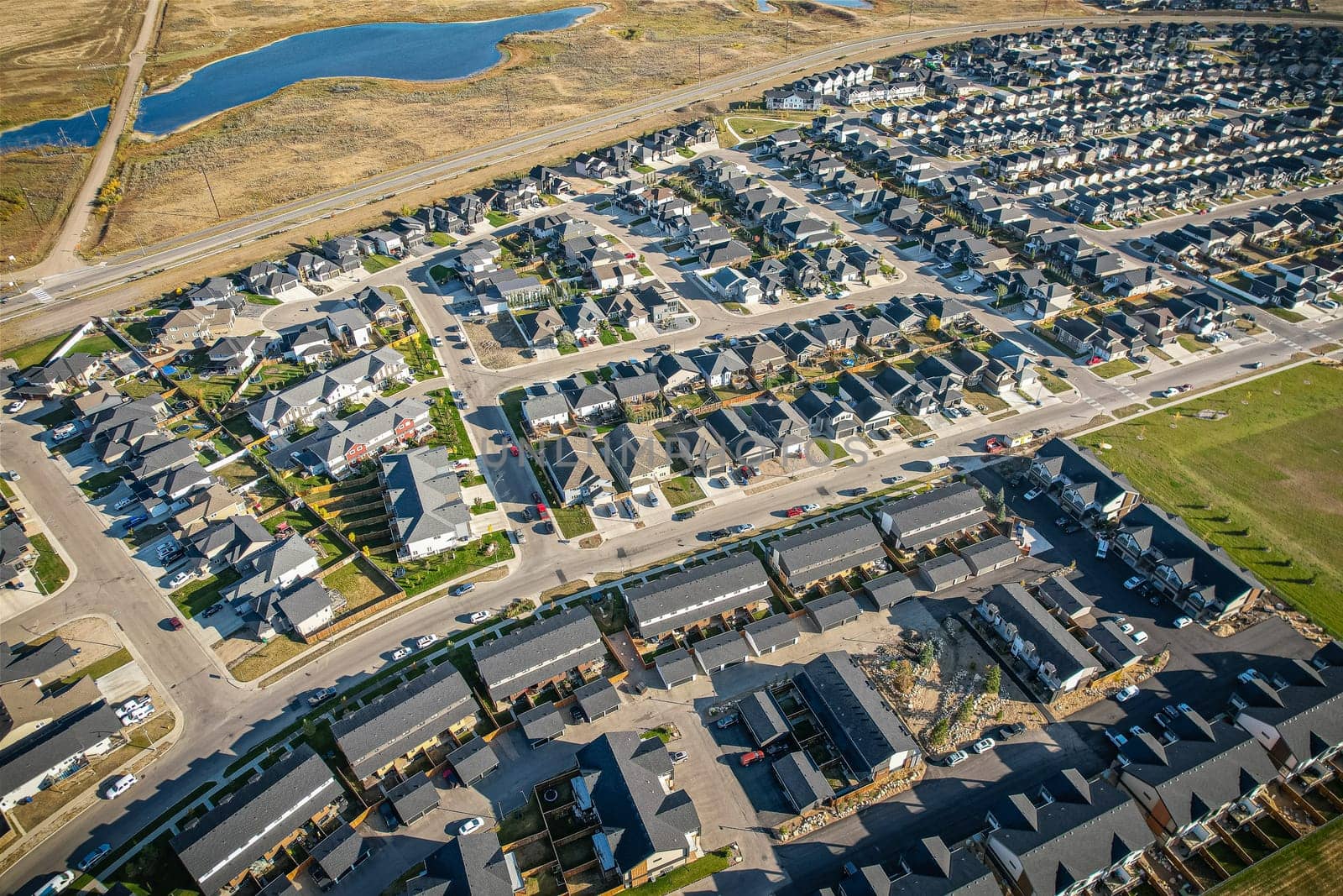 Stunning bird's-eye perspective of the Evergreen neighborhood in Saskatoon, showcasing the unique urban layout and the natural beauty of Saskatchewan's landscapes.