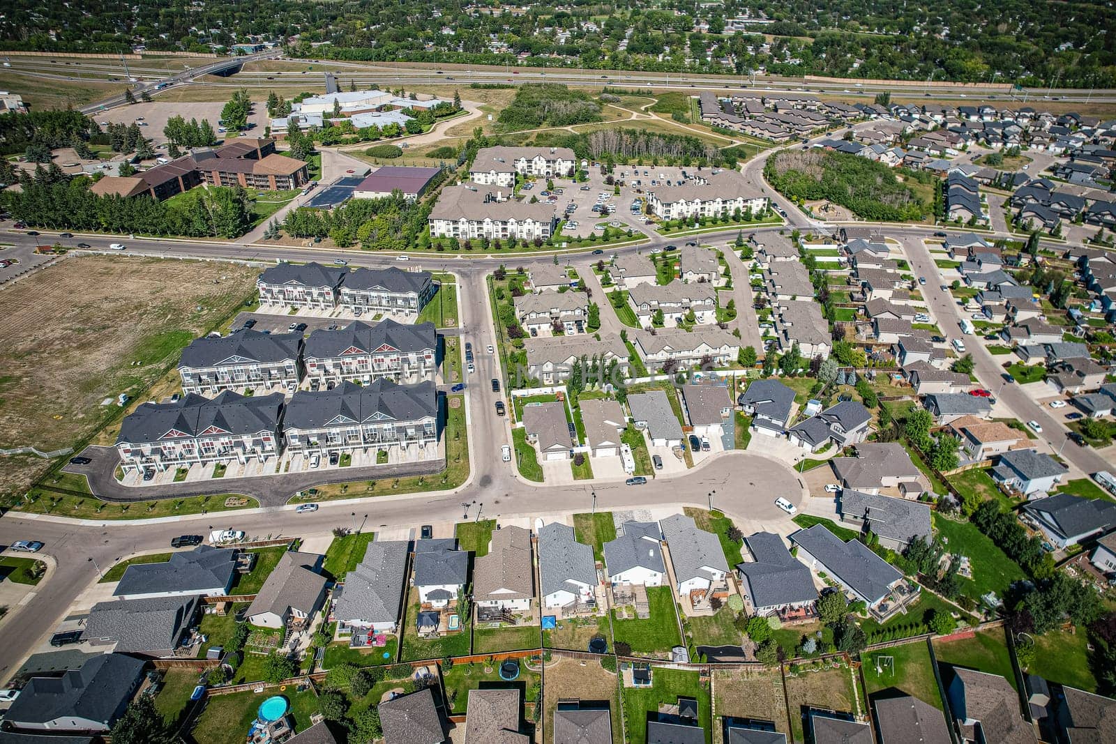 Captivating aerial shot of Stonebridge in Saskatoon, highlighting the harmonious blend of modern architecture and Saskatchewan's verdant surroundings.