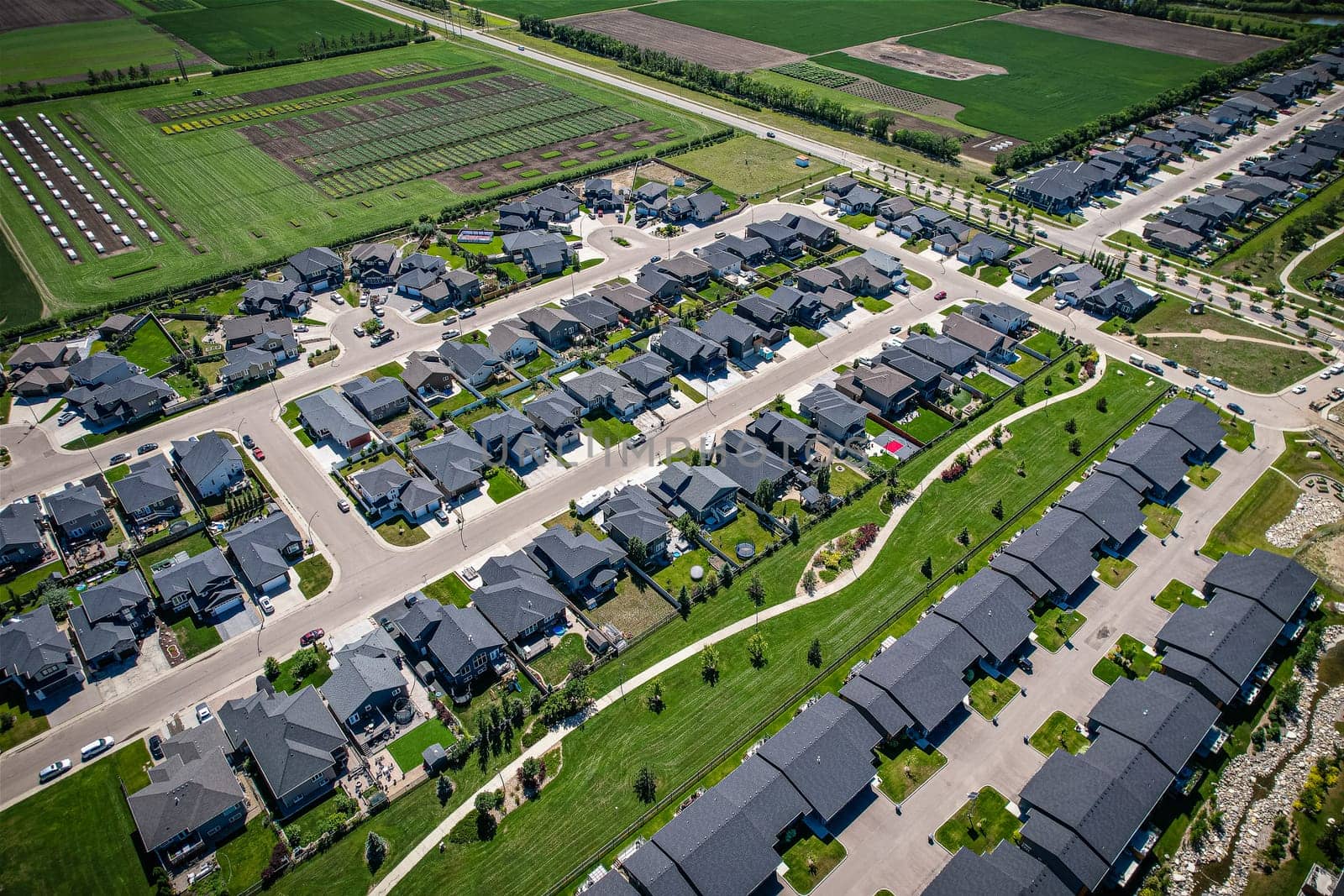 Stunning bird's-eye perspective of the Evergreen neighborhood in Saskatoon, showcasing the unique urban layout and the natural beauty of Saskatchewan's landscapes.