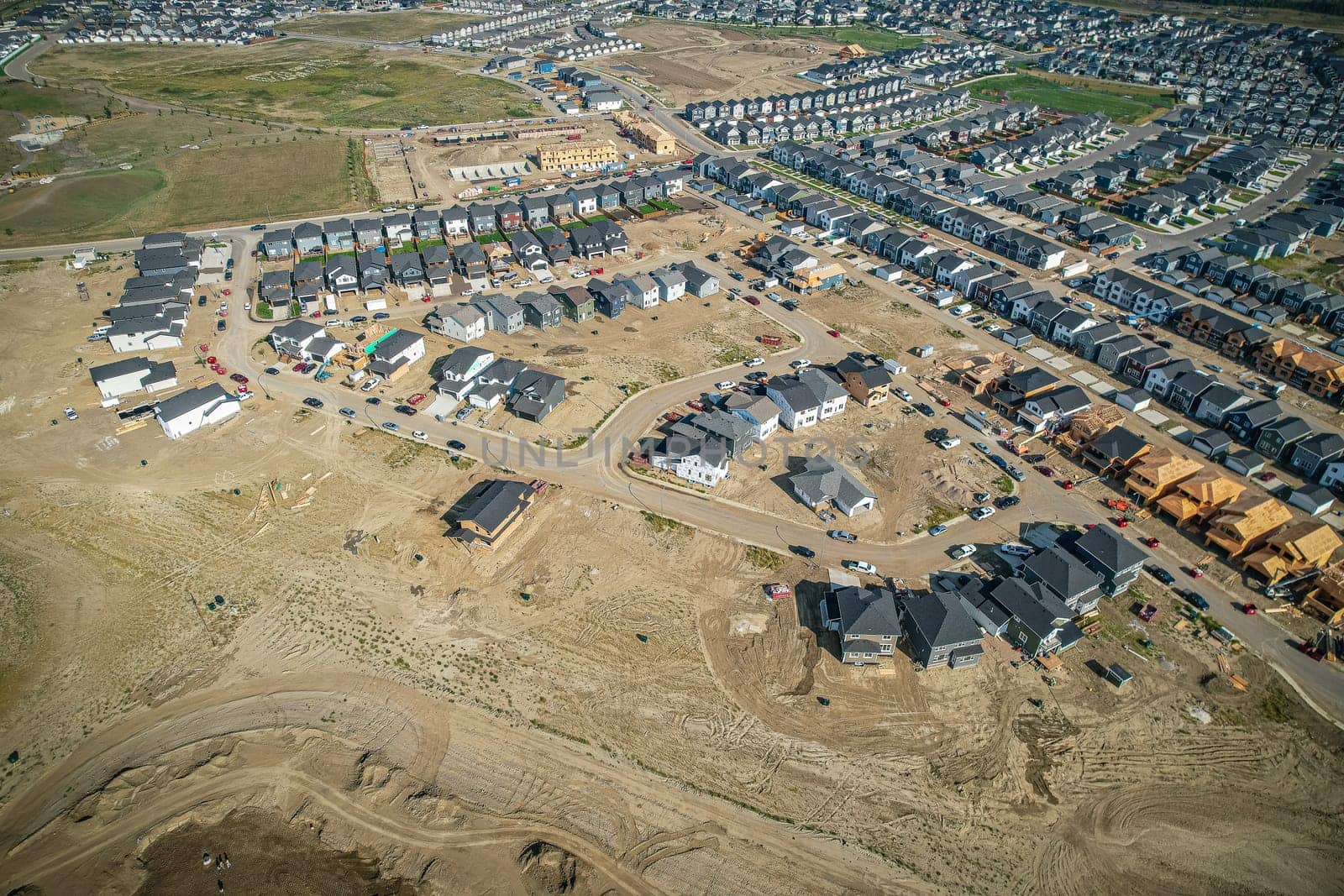 Elevated view of Rosewood neighborhood in Saskatoon, presenting a tapestry of urban design intertwined with Saskatchewan's serene natural canvas.