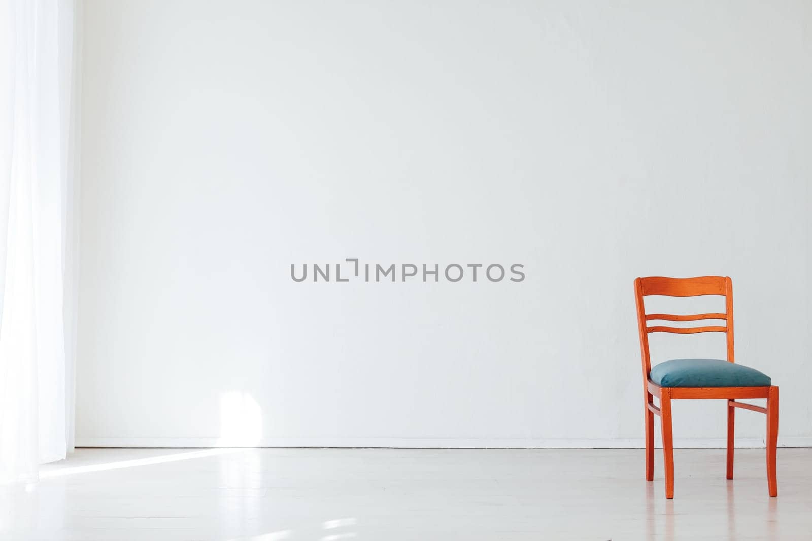 chair in the interior of a white empty room