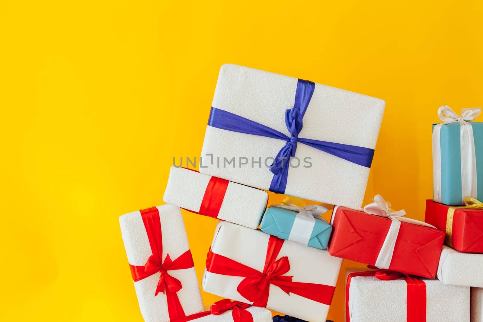 birthday or Christmas presents on a yellow background by Simakov