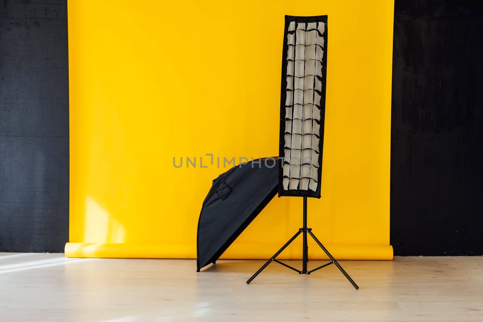 flash and accessories photo studio on a yellow background by Simakov