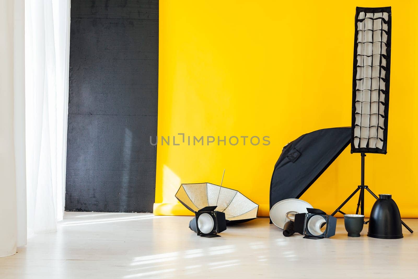 flash and accessories photo studio on a yellow background by Simakov