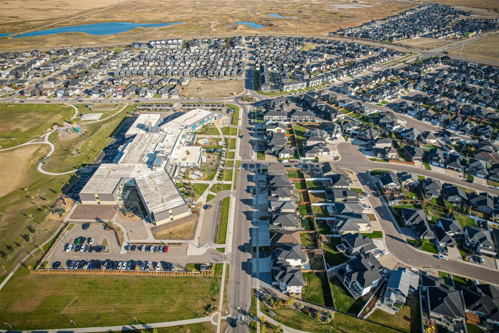 Stunning bird's-eye perspective of the Evergreen neighborhood in Saskatoon, showcasing the unique urban layout and the natural beauty of Saskatchewan's landscapes.