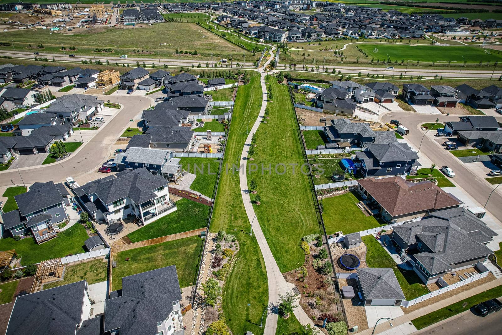 Stunning bird's-eye perspective of the Evergreen neighborhood in Saskatoon, showcasing the unique urban layout and the natural beauty of Saskatchewan's landscapes.