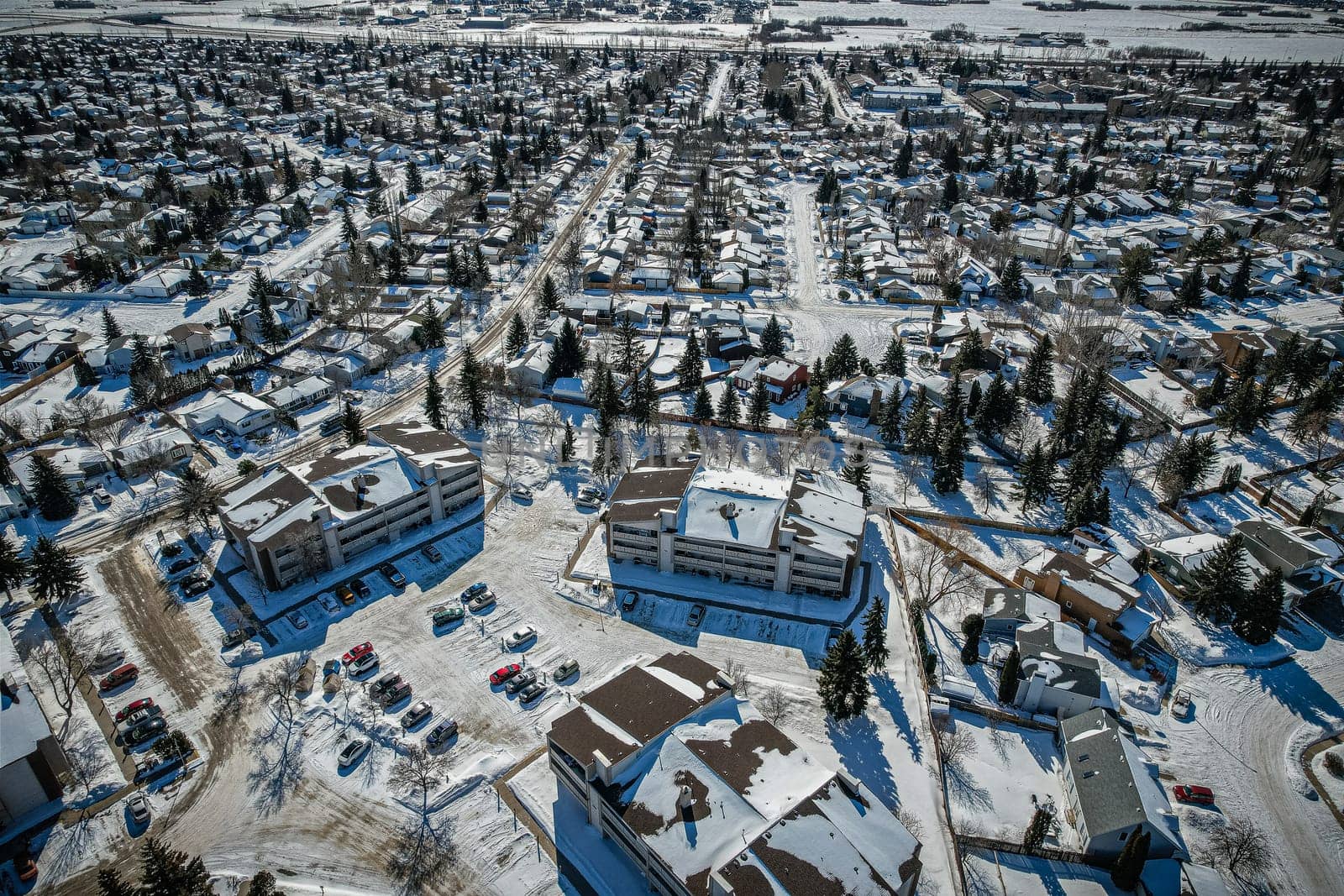 Soaring over Lakeview in Saskatoon, this bird's-eye capture magnifies the neighborhood's tranquil waters, verdant parks, and the serene rhythm of Saskatchewan living