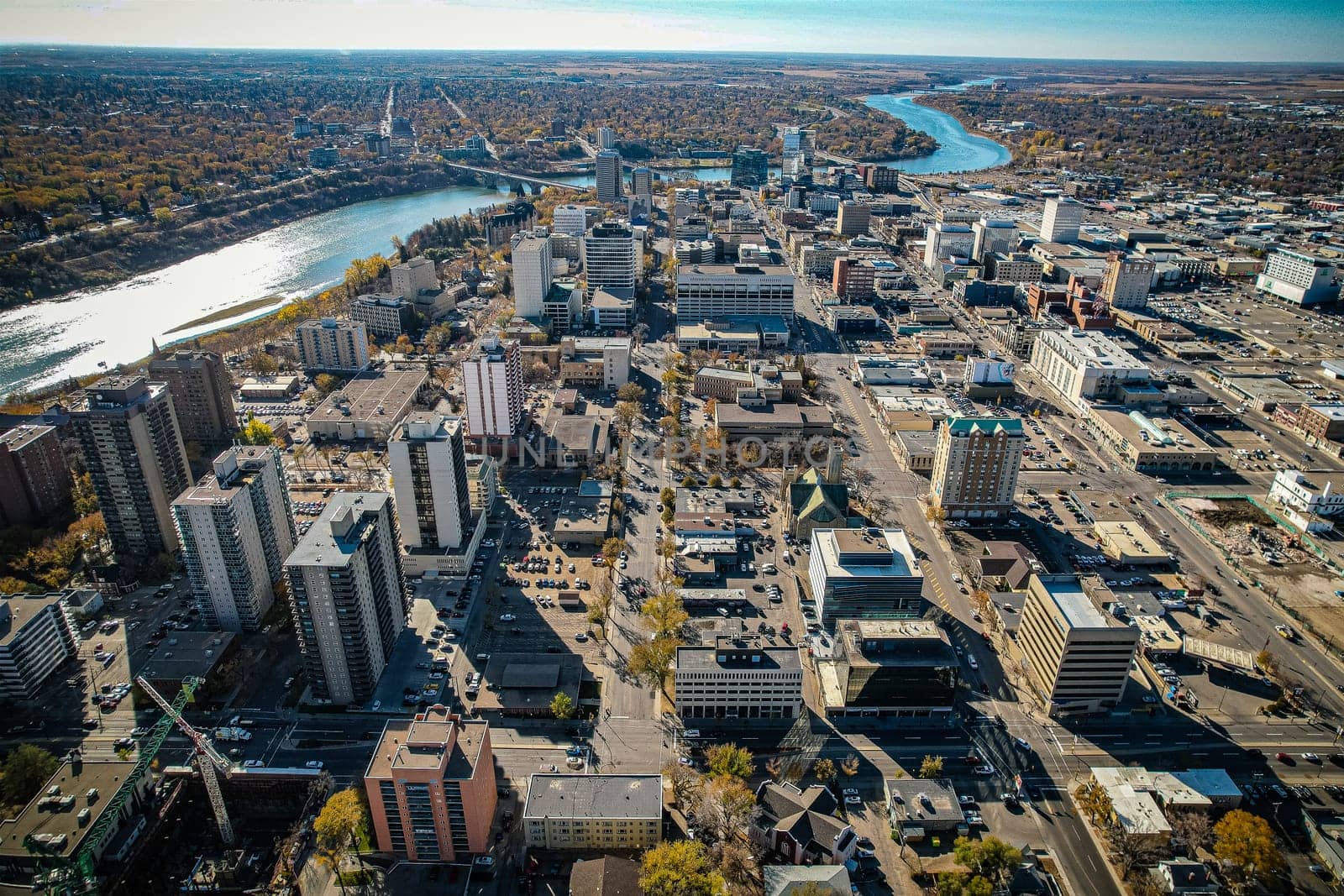 Aerial spectacle of downtown Saskatoon, revealing the city's architectural marvels, bustling streets, and the pulsating core of Saskatchewan's metropolis