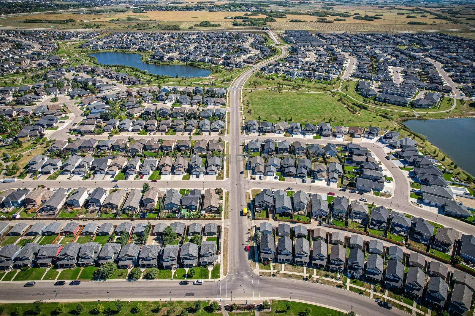 Captivating aerial shot of Stonebridge in Saskatoon, highlighting the harmonious blend of modern architecture and Saskatchewan's verdant surroundings.