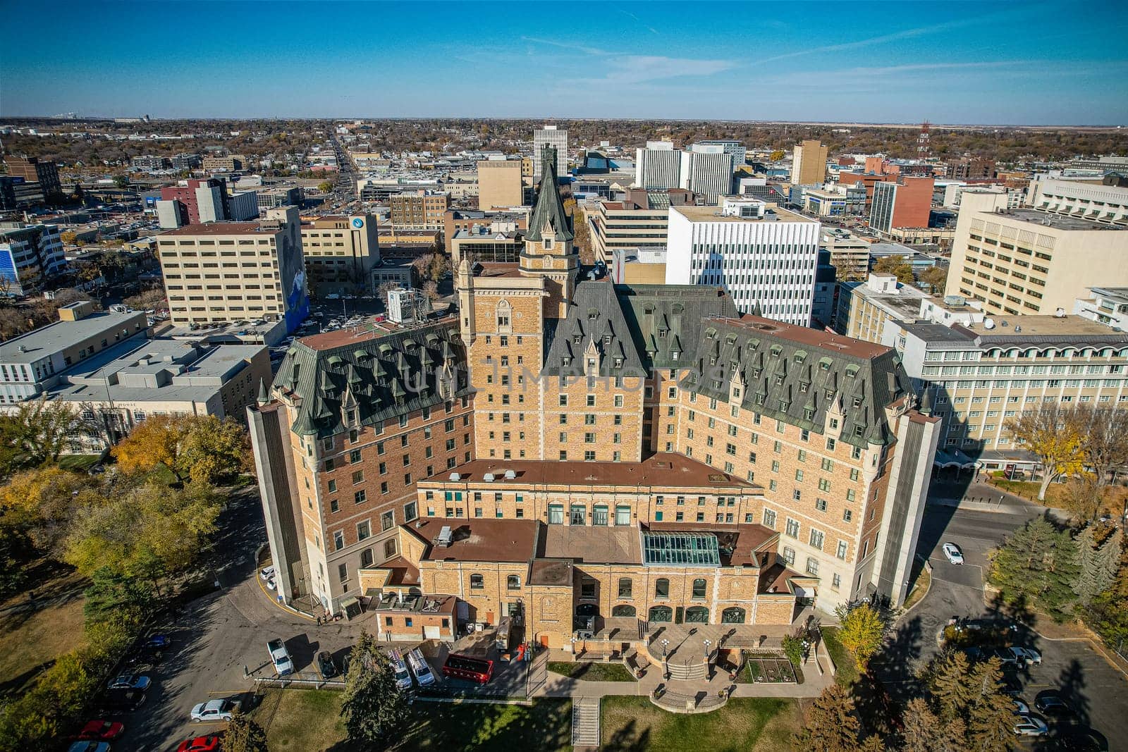 Aerial spectacle of downtown Saskatoon, revealing the city's architectural marvels, bustling streets, and the pulsating core of Saskatchewan's metropolis