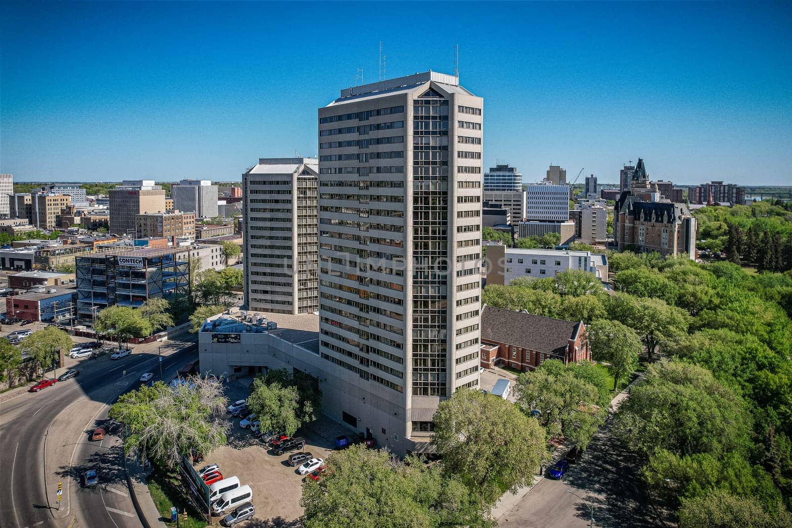 Aerial spectacle of downtown Saskatoon, revealing the city's architectural marvels, bustling streets, and the pulsating core of Saskatchewan's metropolis